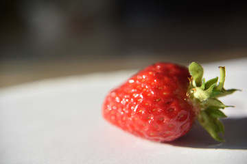 Fresh isolated strawberry on the table