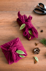 Christmas furoshiki wrapping. Etnical hristmas gift. Zero waste concept