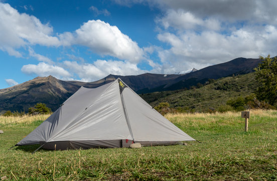 Pitched Tent with Mountains in background © Scottiebumich