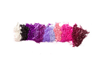 Multi-colored races of eye shadows, different colors are isolated on a white background.