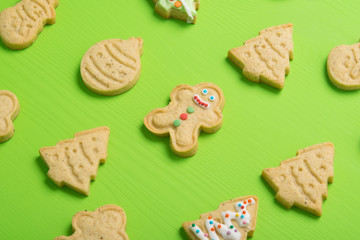 confectionery, gingerbread, neatly laid out, in the form of a Christmas tree, a snowman, on a light green table