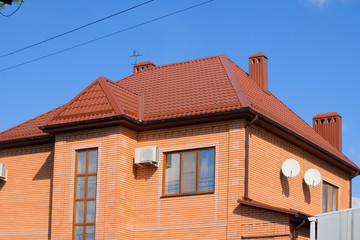 Decorative metal on the roof of the house.
