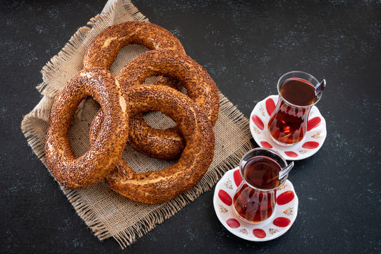 Traditional Turkish bagel simit on the table with black background