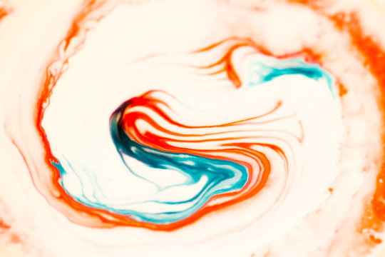 Red And Blue Food Coloring Mixed With Cream