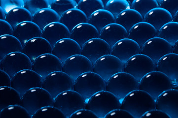 Obraz premium Texture of blue gel balls with blur