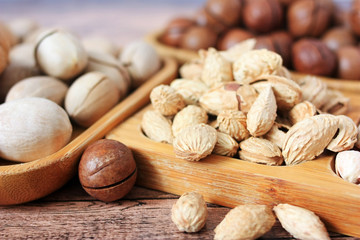 Mix of nuts on wooden plates