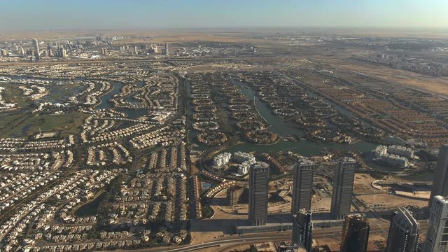 Aerial shot of luxury Emirates Hills and Jumeirah Islands communities in Dubai, UAE