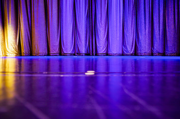 Shiny and shimmering curtain closed on show stage of theatre or lounge on luxury cruise ship liner...