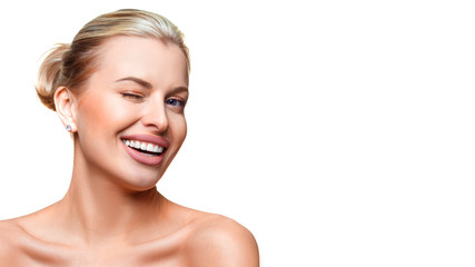 Fototapeta premium Portrait of a young woman with clear fresh skin winking. Isolated on white background.