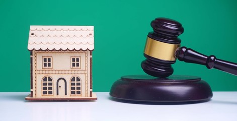 Real Estate concept, judge gavel / lawyer in auction with house model
