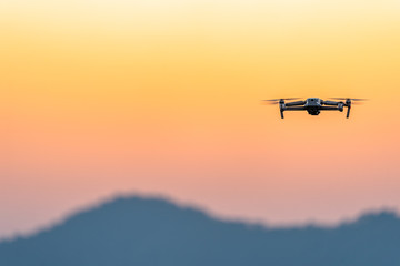 Fototapeta na wymiar Drone flying for take a picture in sunset at Phu Lanka Nan Thailand