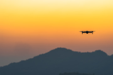 Fototapeta na wymiar Drone flying for take a picture in sunset at Phu Lanka Nan Thailand