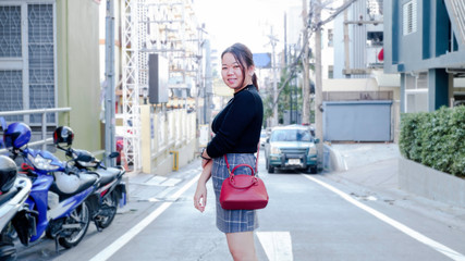 Cute asian girl with city building bacjground in Pattaya, Thailand