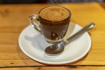 Fresh Cup of Coffee and Spoon