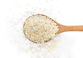 White Sesame Seeds on wooden spoon
