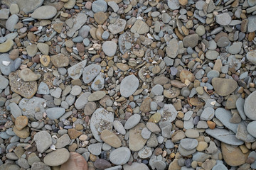 Background image of rocks, stones, pebbles on the shoreline of Lake Erie at Presque Isle State Park.