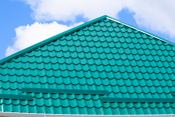 The roof of corrugated green sheet