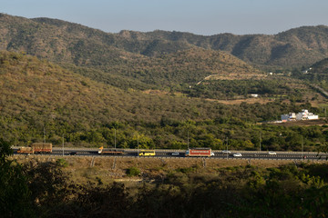 Fototapeta premium NH-8 vehicles passing by, Udaipur, India