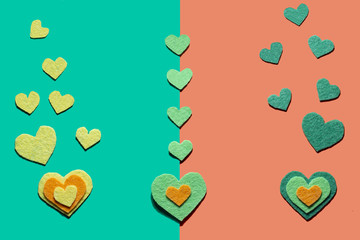 Felt hearts on the green and otrange background. St. Valentine's day
