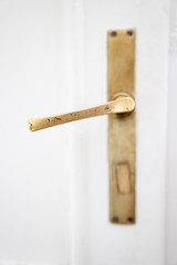 Close up of an old brass door handle