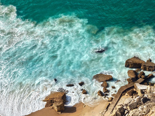 Fototapeta na wymiar Wonderful aerial view of beach and waves at Nazare in Portugal