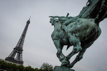 statue attacking the Eiffel Tower