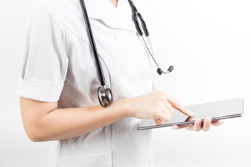 Young asian nurse with a stethoscope using a digital tablet, isolated over white background.