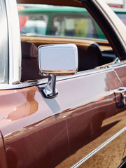 Silver metal rearview mirror retro vintage brown car brown closeup