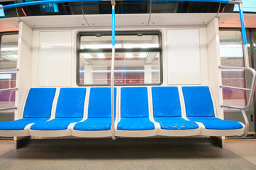 Obraz premium Interior of modern subway carriage with blue seats