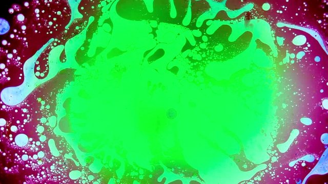 Abstract colorful paint reactions. Psychedelic liquid light show, dye curlicues. Marble background for visual effects, motion graphics. Swirl pattern, ink explosion, kaleidoscope. 60s disco oil wheel.