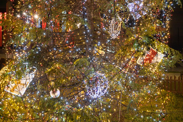 Detail of Christmas tree with lights glowing