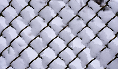 background mesh made of metal wire with snow