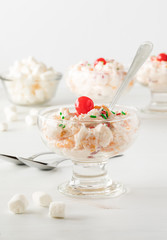 Glass dish of Ambrosia salad.
