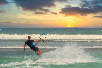 Man acting kite surf in tropical sea