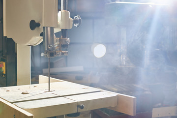 Woodworking Machine. band saw for cutting and sawing boards in a workshop