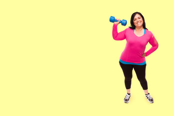 Middle Aged Hispanic Woman In Workout Clothes Holding Dumbbell Against A Bright Yellow Background