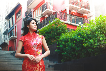Asian white women wear cheongsam dresses to receive the New Year Chinese New Year Festival.