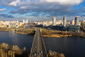 City Traffic on the Patona Bridge. View of Rusanovskaya Embankment.