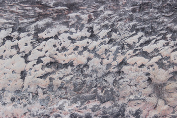 Embossed concrete tinted in pink and black