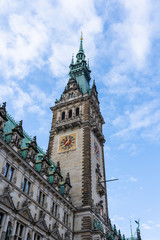 Fototapeta na wymiar Neo-renaissance Rathaus clock tower facade at Rathausmarkt in Hamburg city hall