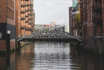 Ellerntorsbrucke bridge between old red brick building near Herrengrabenfleet in Hamburg, Germany