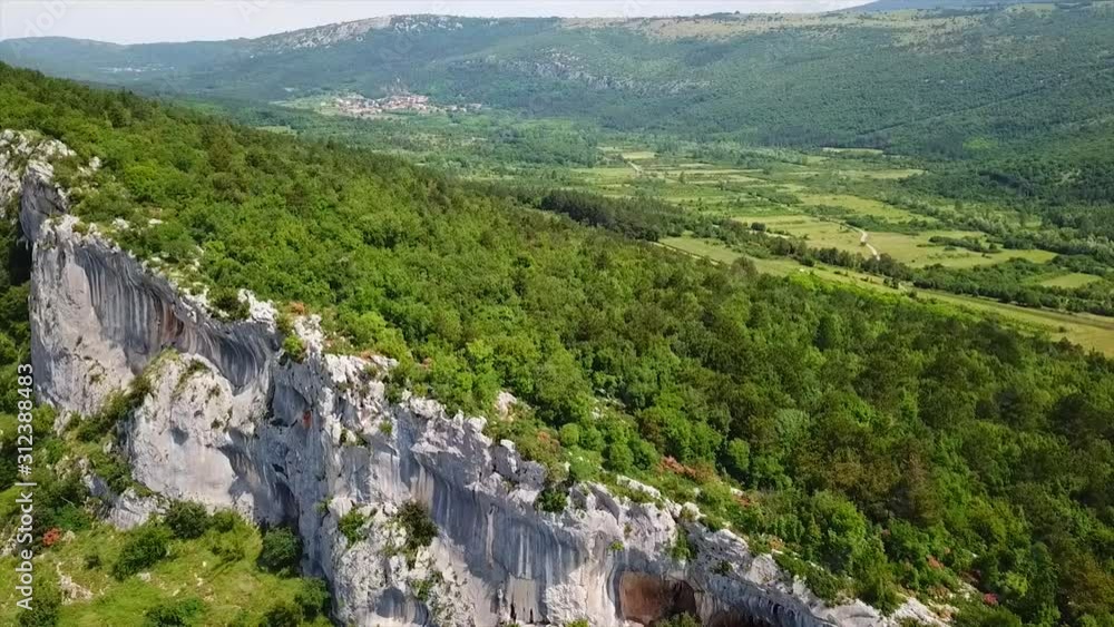 Poster Huge limestone wall in karst landscape in Slovenia