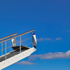 Travel concept: a gangway in front of blue sky