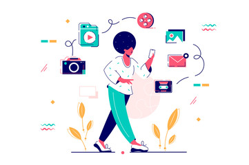 Young african american woman with afro hairstyle and smartphone.