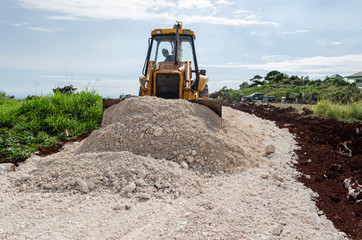 Using Front End Bucket To Spread Marl On New Road