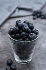 Blueberries in glass cup, selective focus. Blueberries isolated.