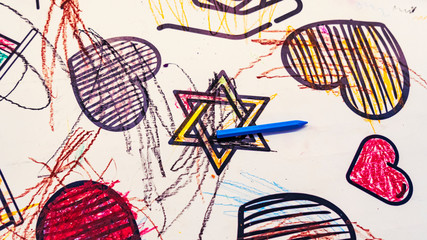 Childrens drawing of star of David, magendovid or mogendovid, with the blue pencil and drawings hearts . Hannukah and jewish concept and symbol.