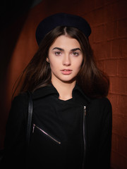 Mood contrasty portrait young elegant french style brown haired woman in beret and black leather...