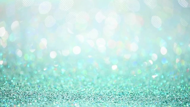 Blue and silver abstract bokeh lights. Shiny glitter background. New year and Christmas concept. Sparkling greeting card