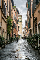 Obraz na płótnie Canvas A beautiful Roman courtyard on Coronari street. Selective focus. Rome, Lazio, Italy